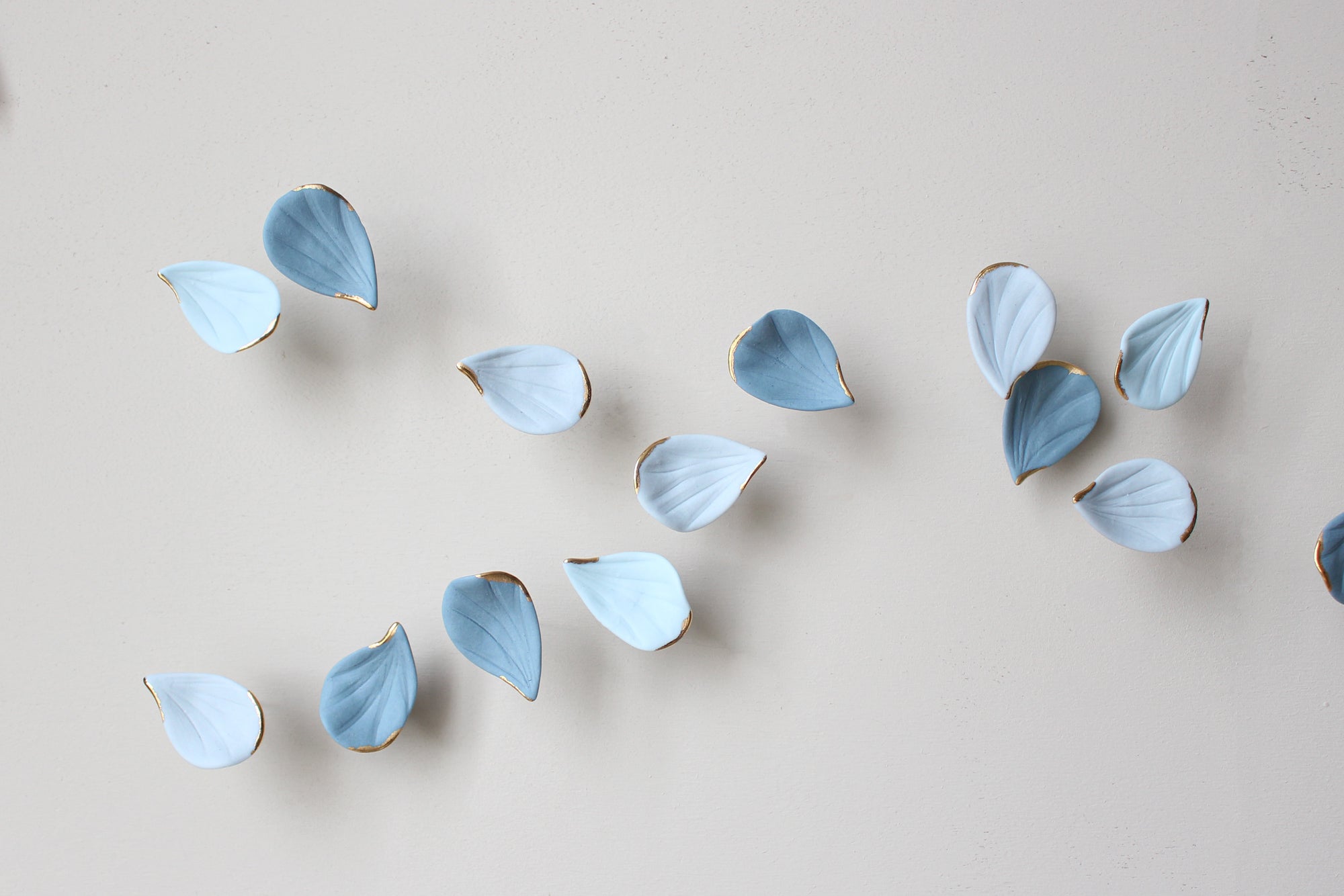 Blue Autumn is a Large porcelain wall art of Blue Leaves handmade in France by Alain Granell
