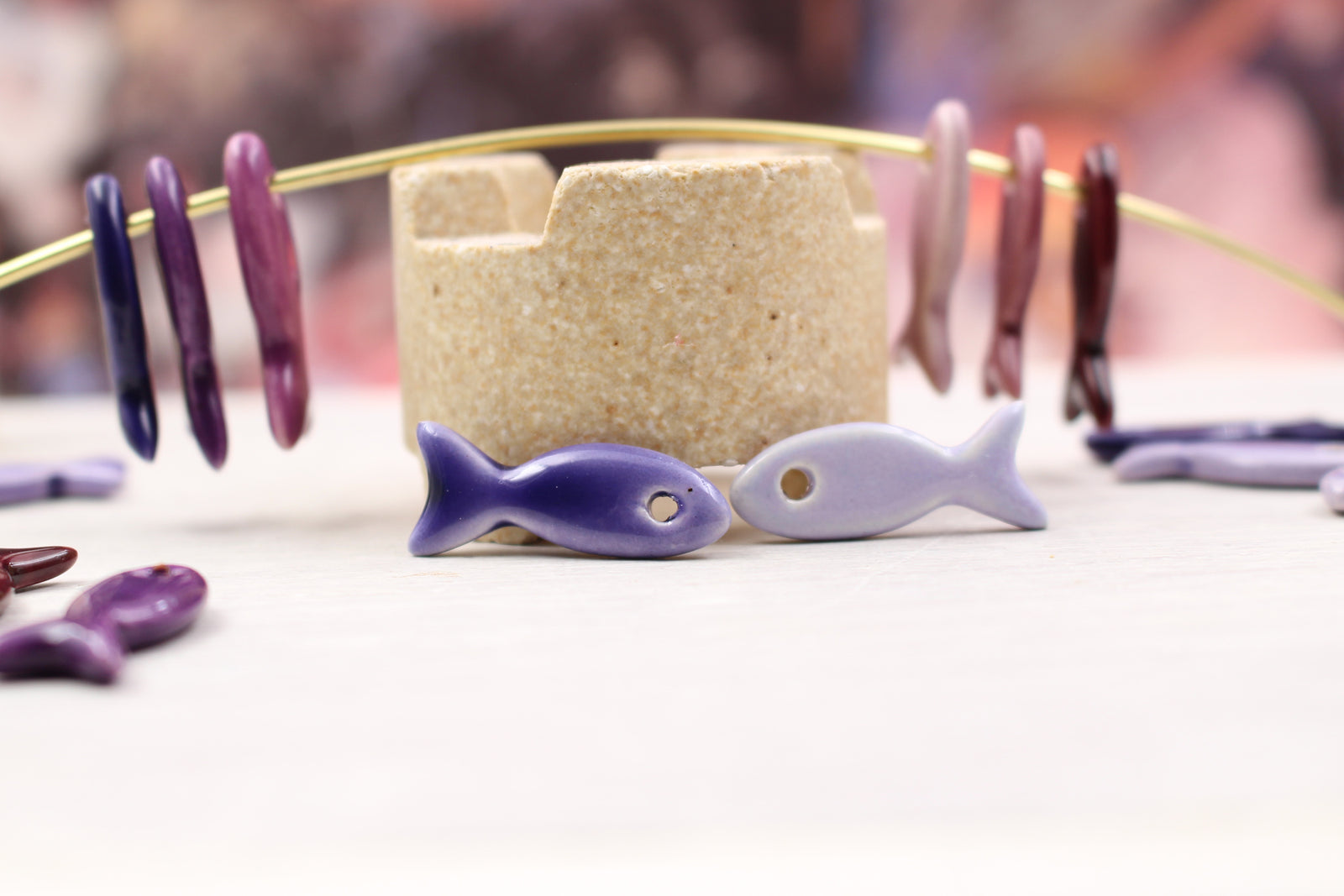 Ceramic fish charms for jewelry and accessories handmade in France by Alain Granell