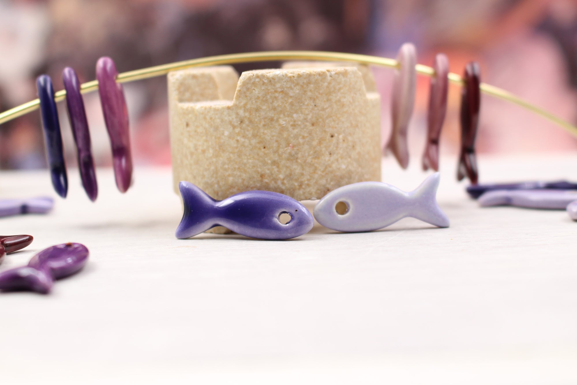 Ceramic fish charms for jewelry and accessories handmade in France by Alain Granell