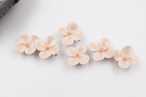 Handmade ceramic clovers for jewelry and accessories making