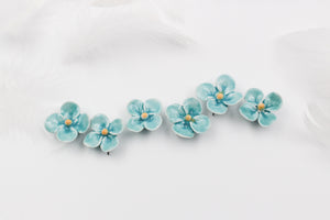 Handmade ceramic clovers for jewelry and accessories making