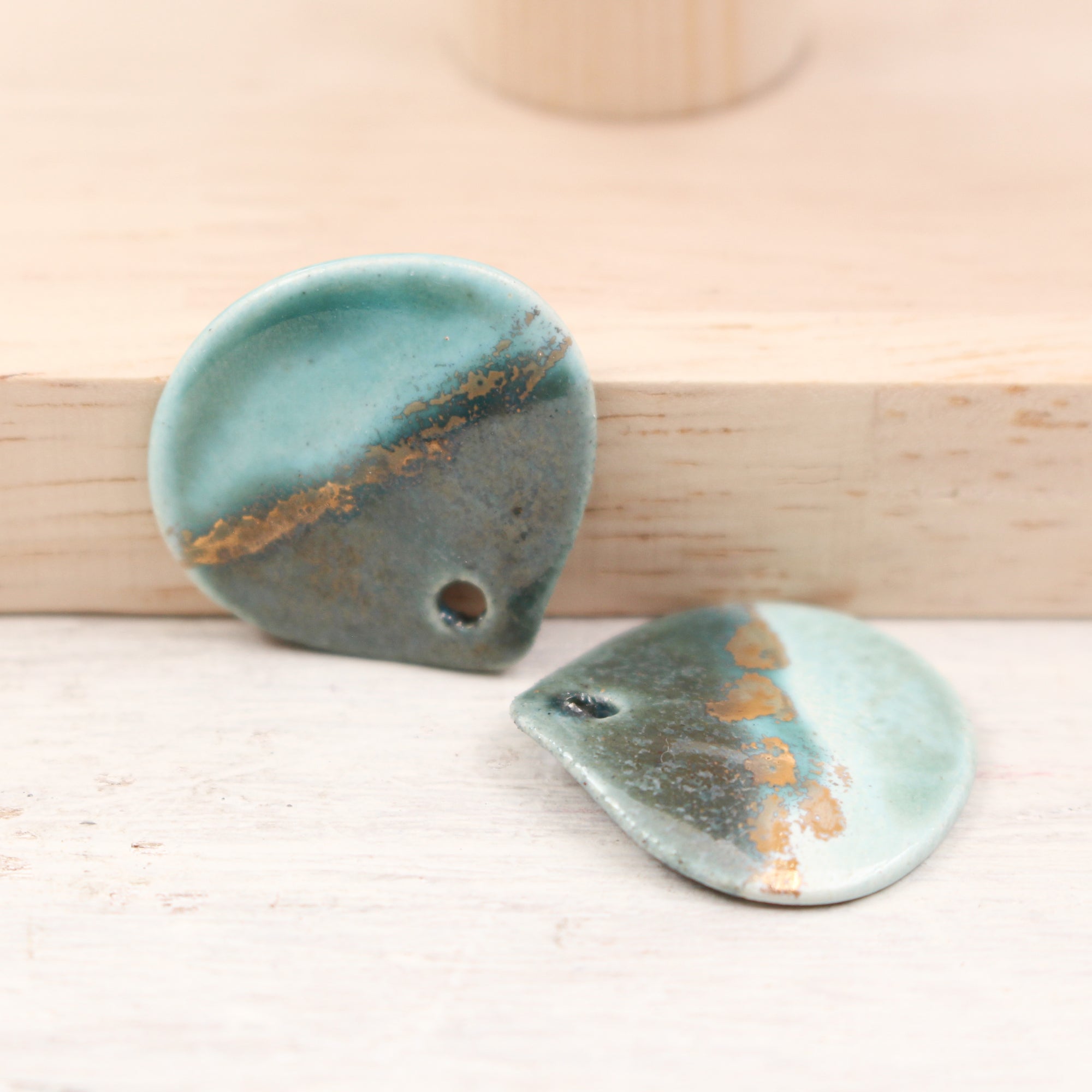 Multicolor ceramic and gold petal charms handmade in France by Alain Granell