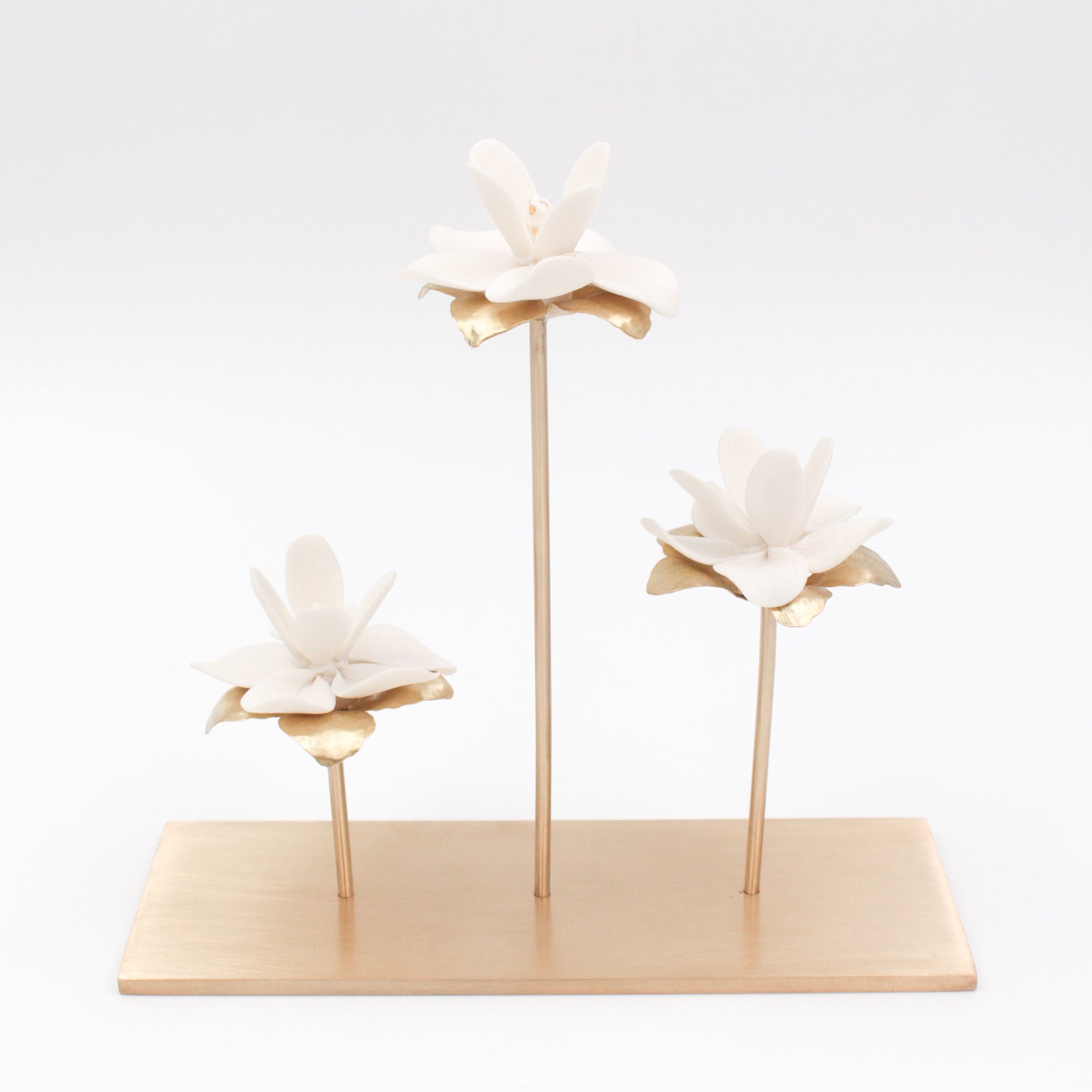 Porcelain magnolia flowers on brass tree for interior decoration - by Alain Granell